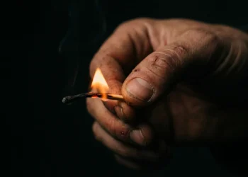 Lit match burning down to fingertips — burnout quiz