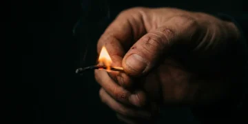 Lit match burning down to fingertips — burnout quiz