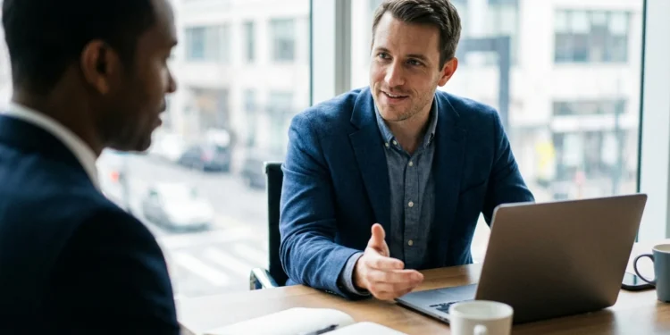 Two professionals negotiating salary at a desk in an office setting